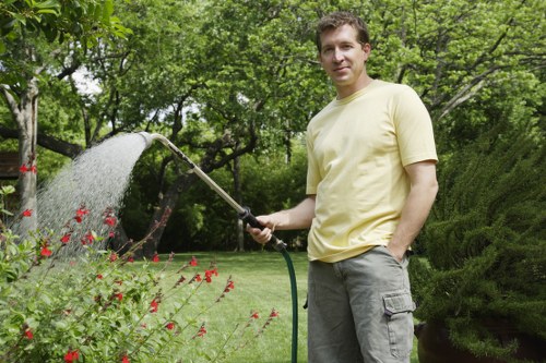 Gardener performing accessible-friendly landscaping in a Wandsworth yard